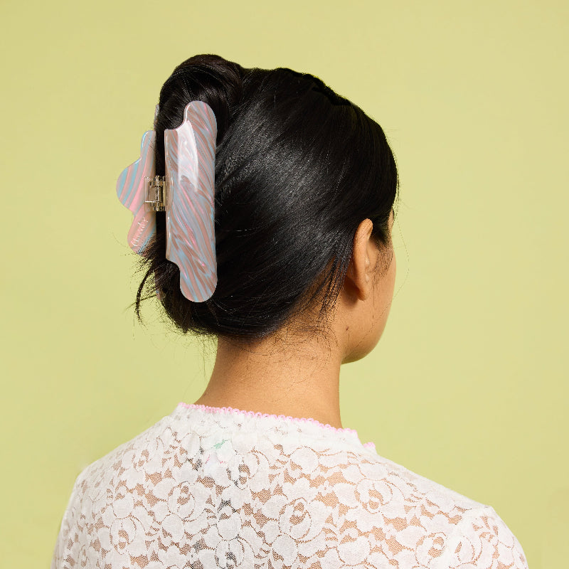 Chunks Nimbus Hair Claw Clip in Fuel shown in models hair on a light green background
