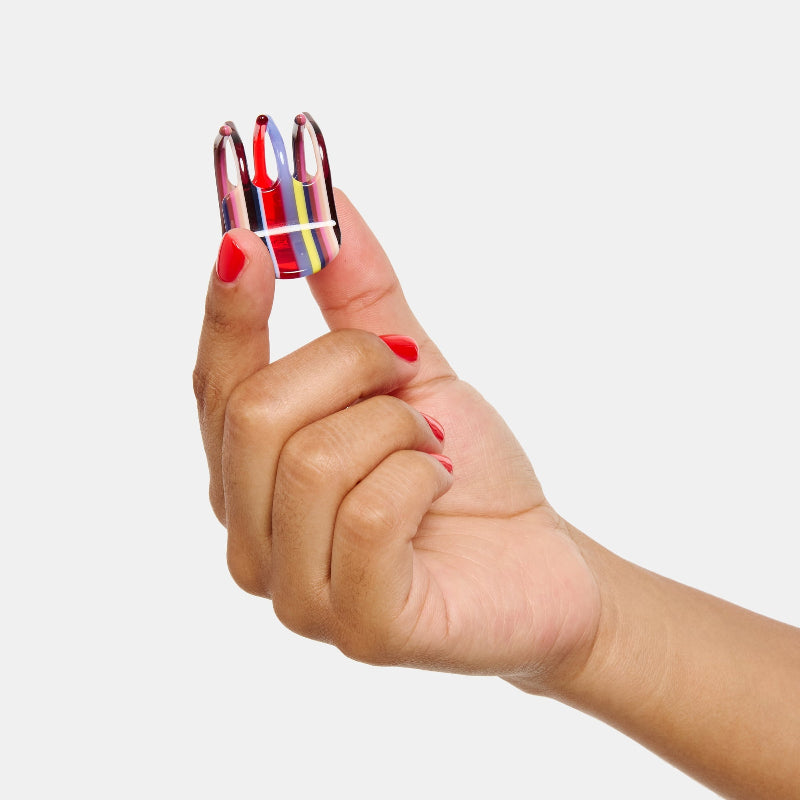 Hand holding Chunks Mini Claw in Charlotte on white background