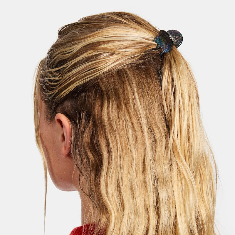Chunks Mini Claw Clip in Dark Sparkle shown on a woman wearing a half up half down hairstyle