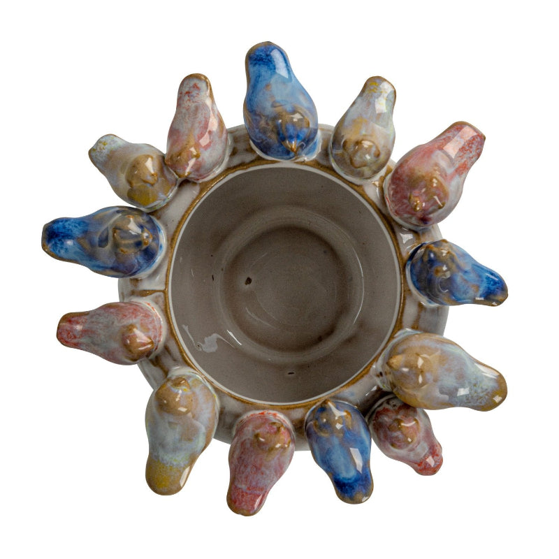 Inside of Ceramic Planter Pot looking from the top. Small stoneware birds go around the rim in different ceramic glaze colors.