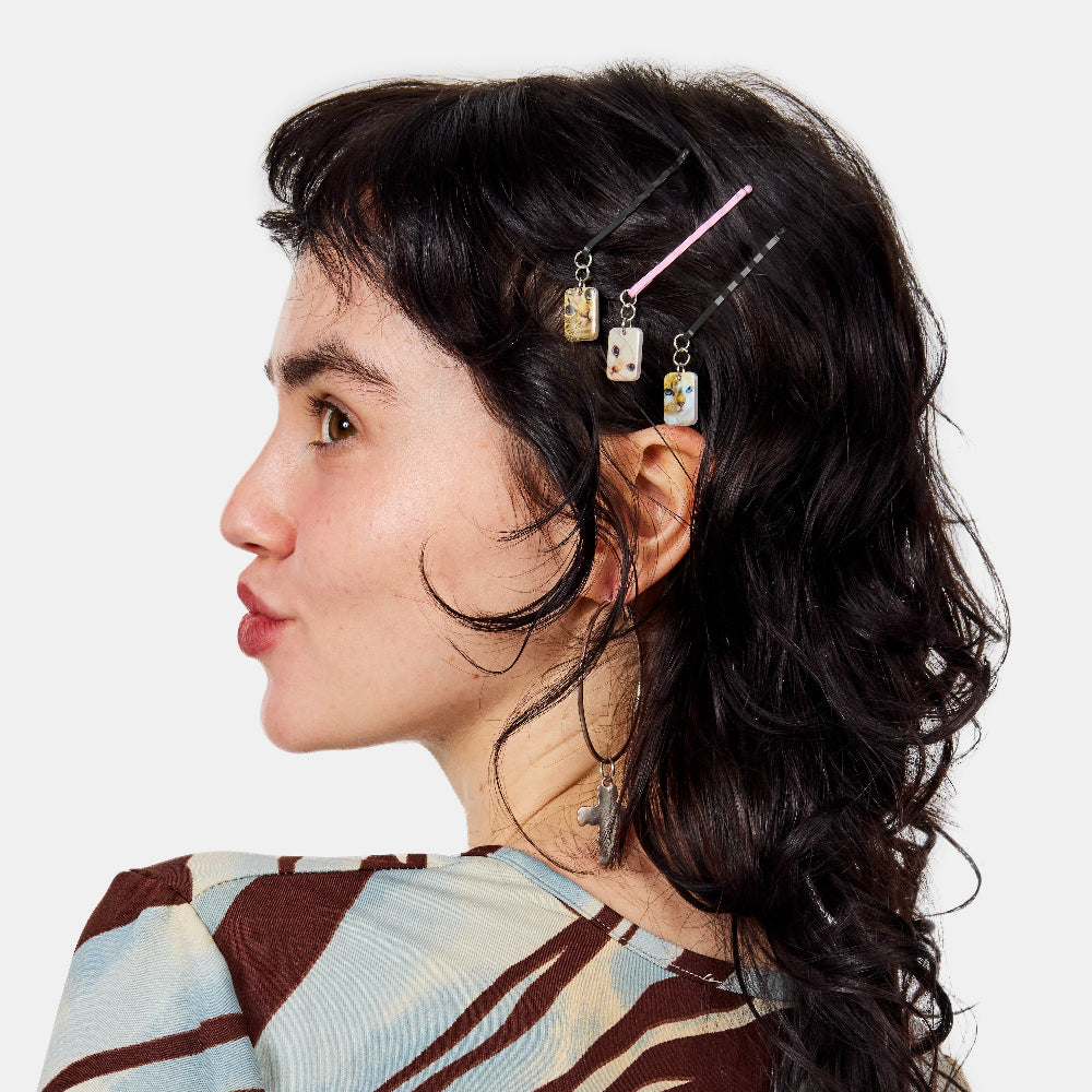 Chunks Kitty Bobby Pins shown pinned in a womans hair