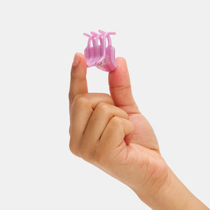 Hand holding Chunks Mini Hair Claw Clip in Petunia on a white background