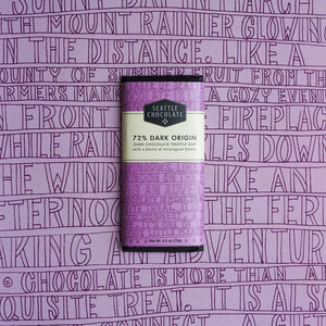Seattle Chocolate 72% Dark Origin Dark Chocolate Truffle Bar on a purple background